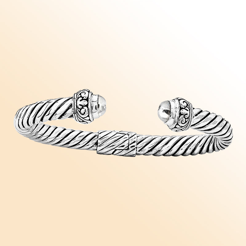 Handcrafted sterling silver cable cuff Bangwith ornate dome ends in Bali artisan design"e