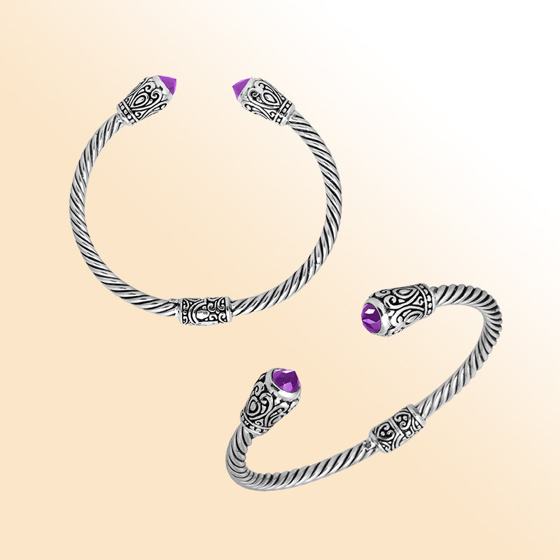 Handmade silver bangle with amethyst quartz ends and Balinese carved design
