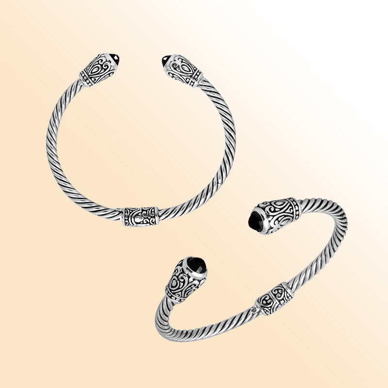 Handmade silver bangle with black onyx ends and Balinese carved design