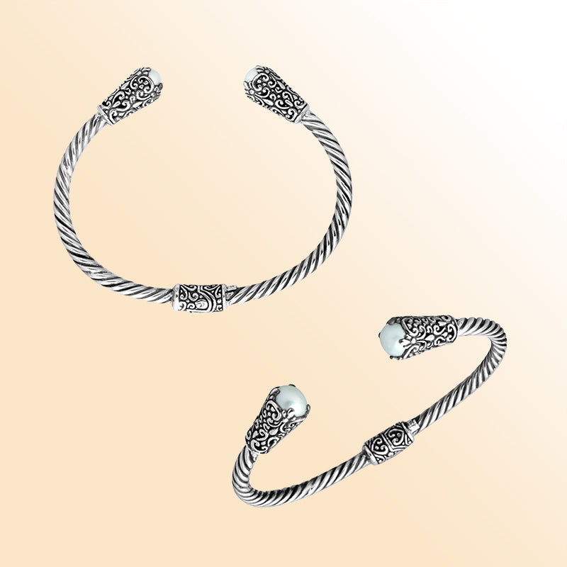 Handmade silver bangle with pearl ends and Balinese carved design