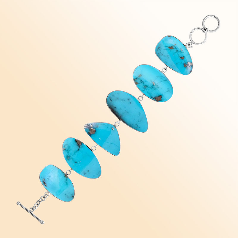 Sterling Silver bracelet with vibrant Turquoise Shell panels, handcrafted in Bali.