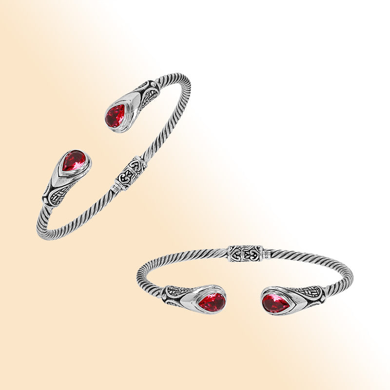 Sterling silver Balinese cuff bangle with Garnet Quartz accents and ornate scroll design.