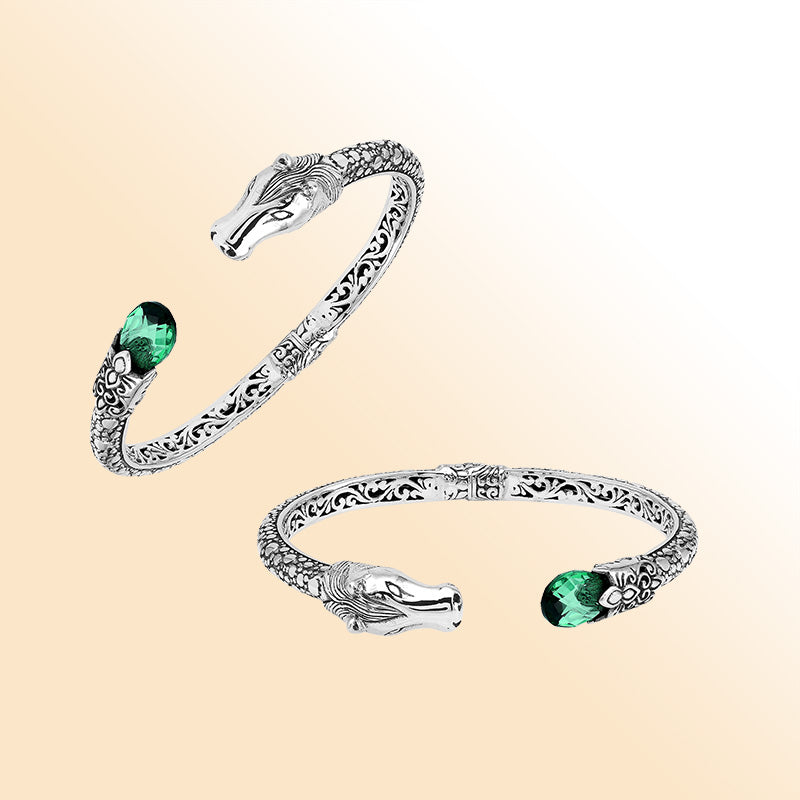 Handcrafted sterling silver dragon head bangle with Green Quartz from Bali featuring detailed filigree and antique silver finish.