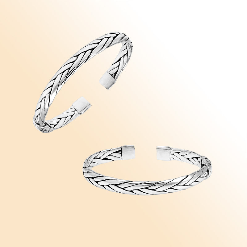 A handcrafted sterling silver small bangle featuring woven Balinese textures, polished finishing, and a strong hinge lock designed for stylish everyday wear.