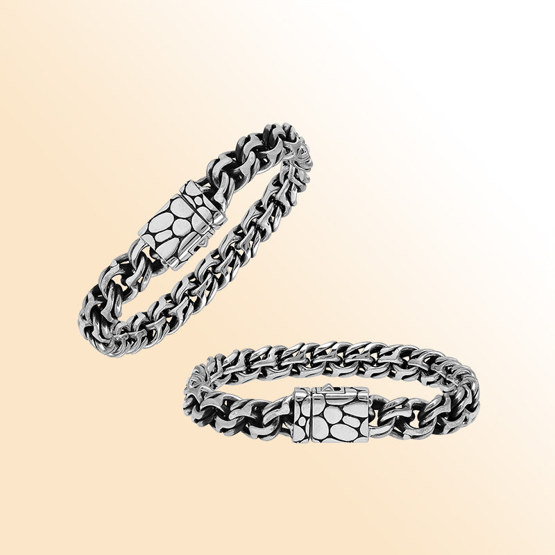 A handcrafted sterling silver rugged woven bracelet featuring a textured push clasp, polished and oxidized detailing, and bold masculine styling perfect for everyday wear.