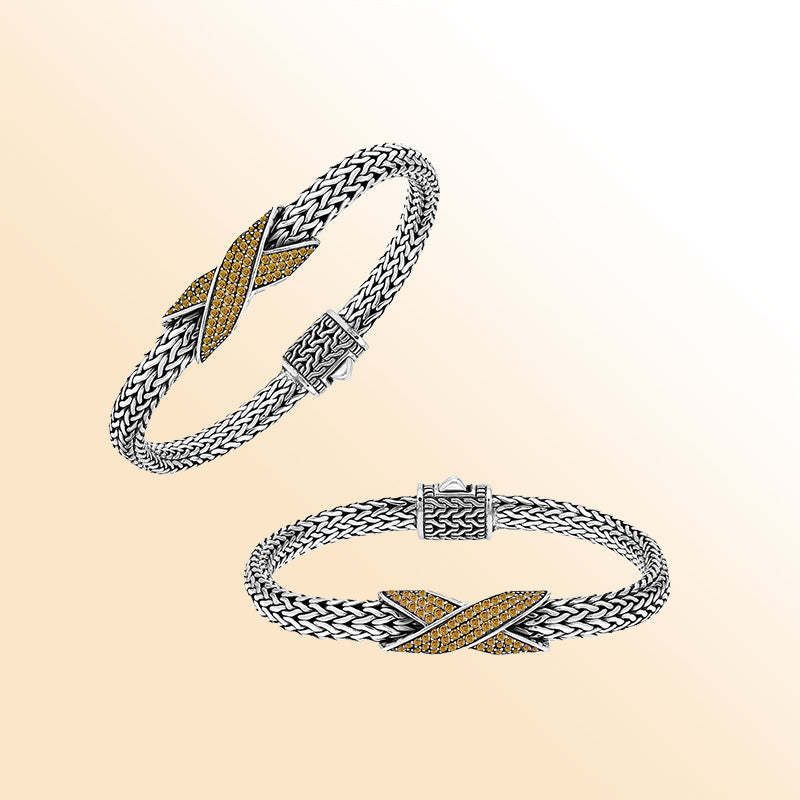 Handcrafted sterling silver woven bracelet featuring a radiant purple Citrine quartz crossover design from Bali.