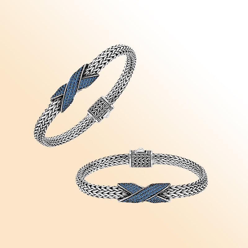 Handcrafted sterling silver woven bracelet featuring a radiant purple Sapphire quartz crossover design from Bali.