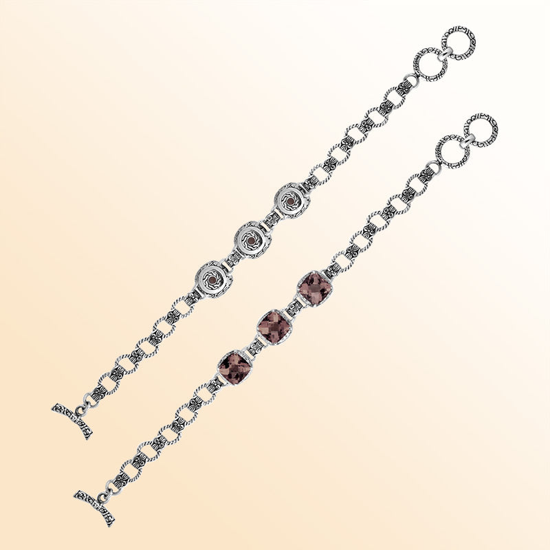 Retail sterling silver bracelet featuring earthy Smokey Quartz stones set in ornate Balinese frames with textured chain details and a smooth toggle lock for elegant everyday styling.