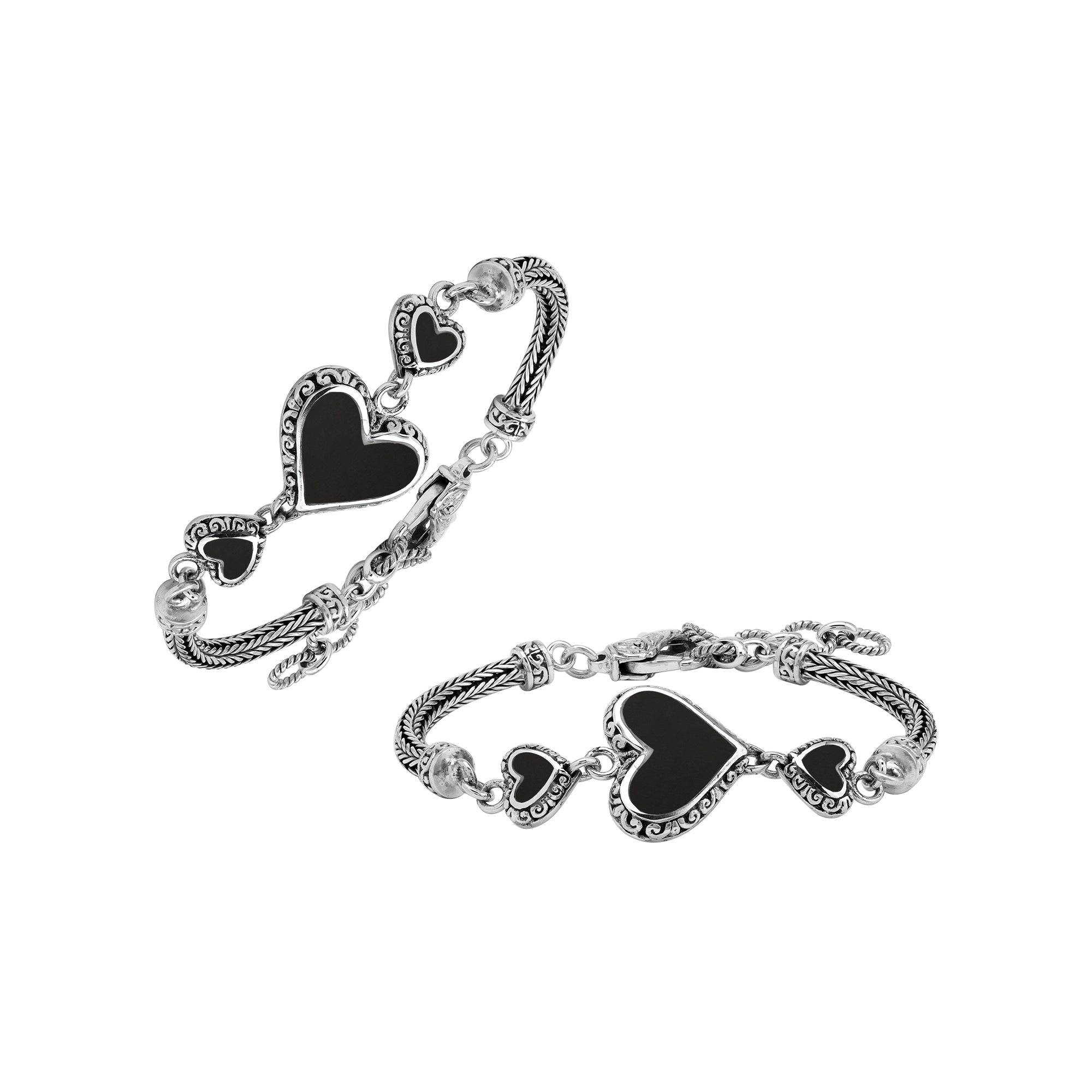 Handcrafted sterling silver bracelet featuring Black Shell heart motifs, intricate Balinese scroll engravings, and a secure lobster lock for bold, expressive, artisan-inspired everyday wear.