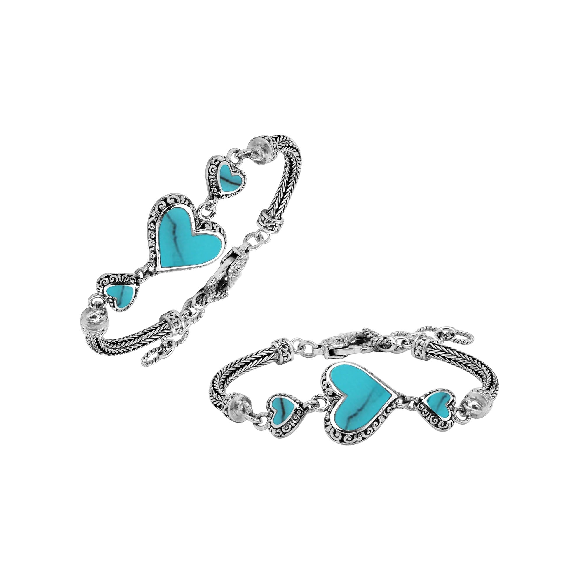 Handcrafted sterling silver bracelet featuring Turquoise Shell heart motifs, ornate Balinese scroll engravings, and a secure lobster lock for colorful, expressive, artisan-inspired everyday style.