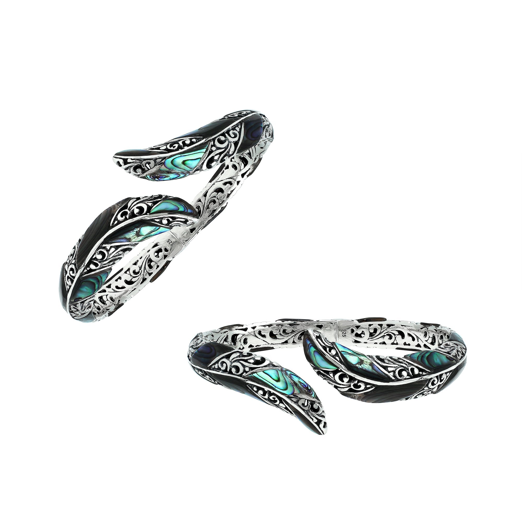Handcrafted sterling silver feather-inspired bangle featuring luminous Abalone Shell inlays, ornate Balinese scroll engravings, and a secure hinge lock for expressive, artistic everyday wear.