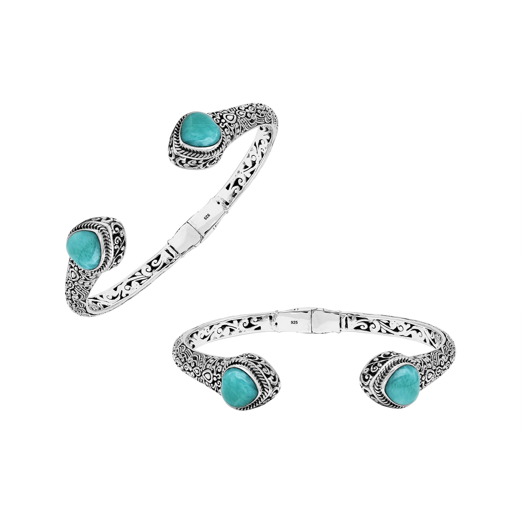 Handcrafted sterling silver bangle featuring two Larimar end stones, ornate Balinese scroll engravings, and a secure hinge lock for elegant, artisan-inspired everyday wear.