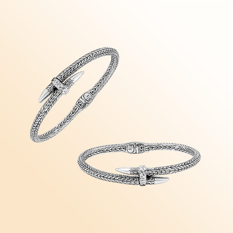 Handcrafted sterling silver woven chain bangle featuring a nail-head design, ornate Balinese scroll engravings, and a secure hinge lock for bold, artisan-inspired daily wear.
