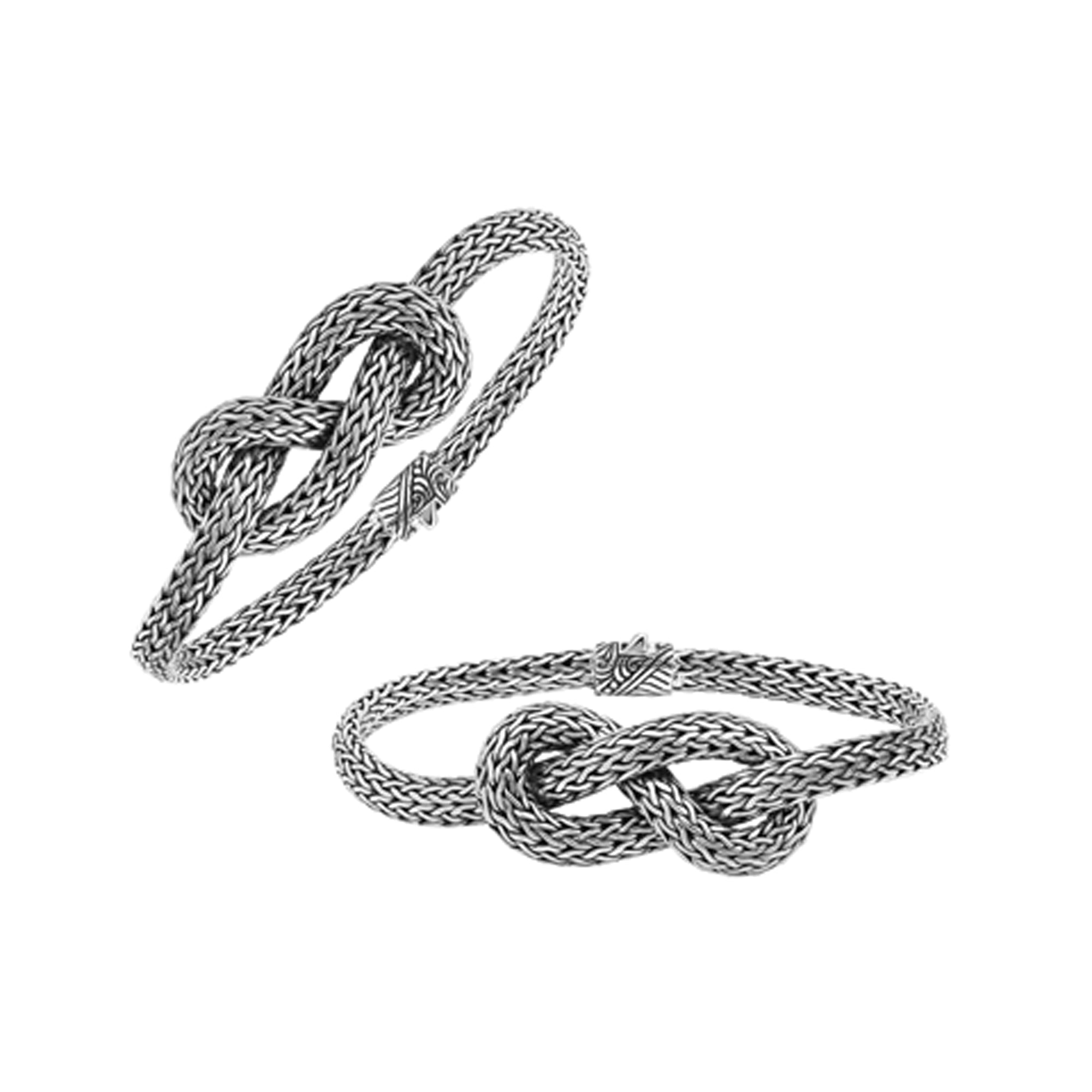 Handcrafted sterling silver bracelet featuring an elegant woven knot centerpiece, detailed chain texture, and a secure push clasp for stylish everyday or special-occasion wear.