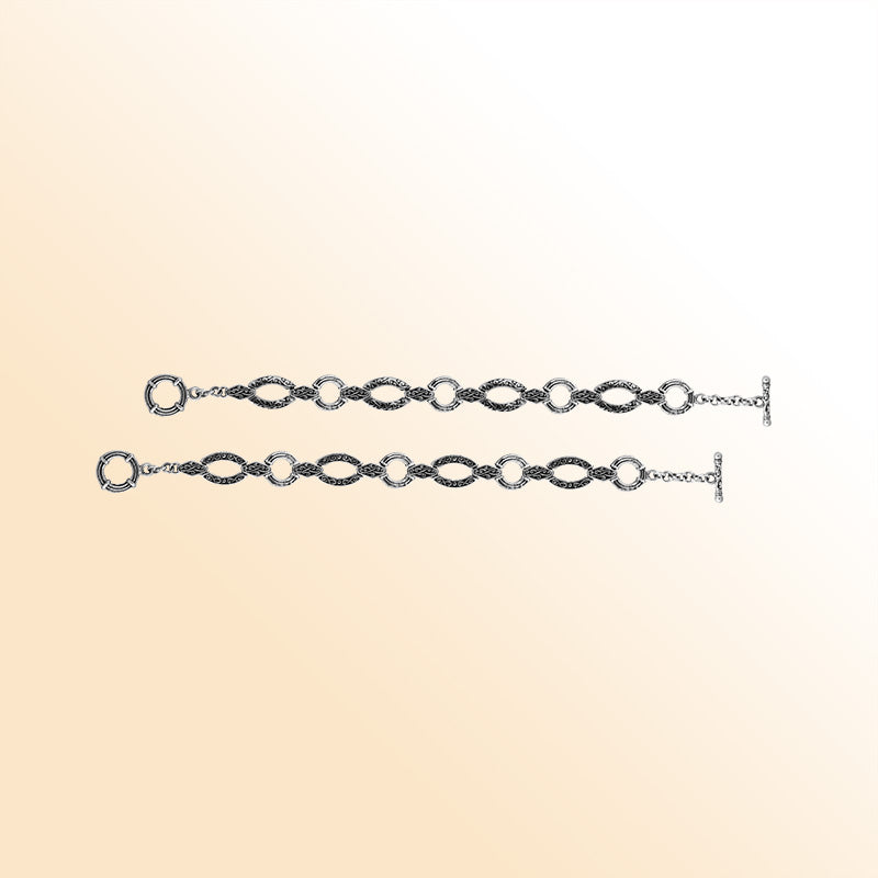 Sterling silver Bali infinity-link bracelet featuring engraved detailing and smooth connectors, finished with a toggle closure for elegant and comfortable daily wear.