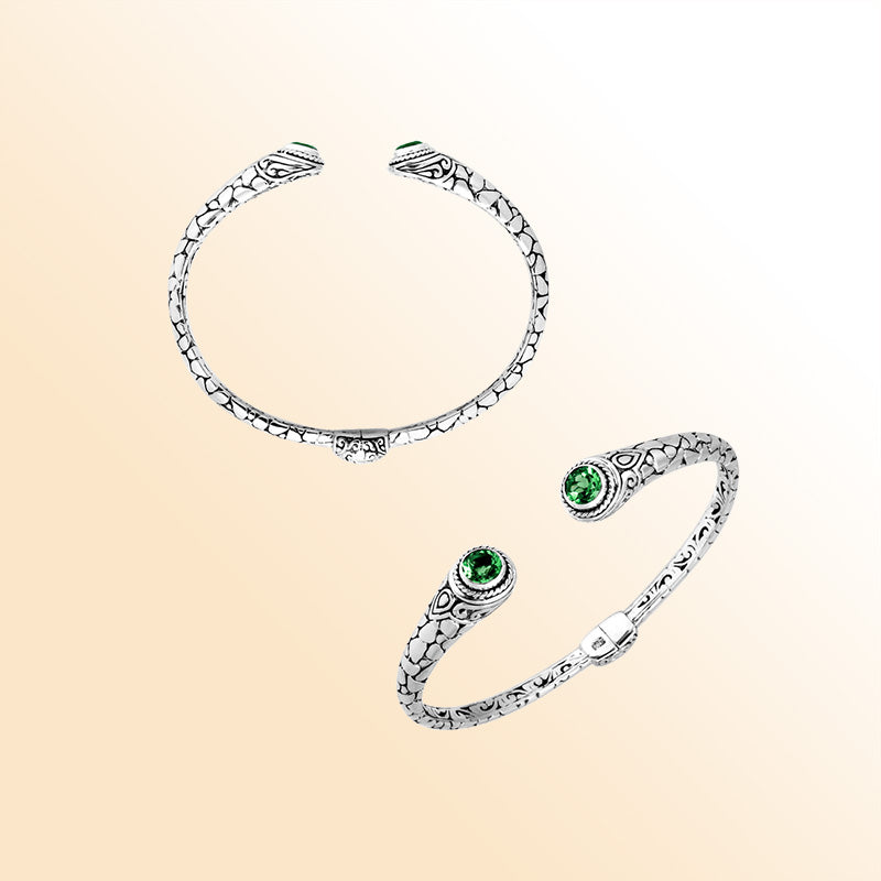 Sterling silver Bali hinge cuff bracelet featuring luminous green quartz ends and polished–oxidized engravings, crafted for individuals who enjoy expressive, artistic, and finely detailed jewelry pieces.