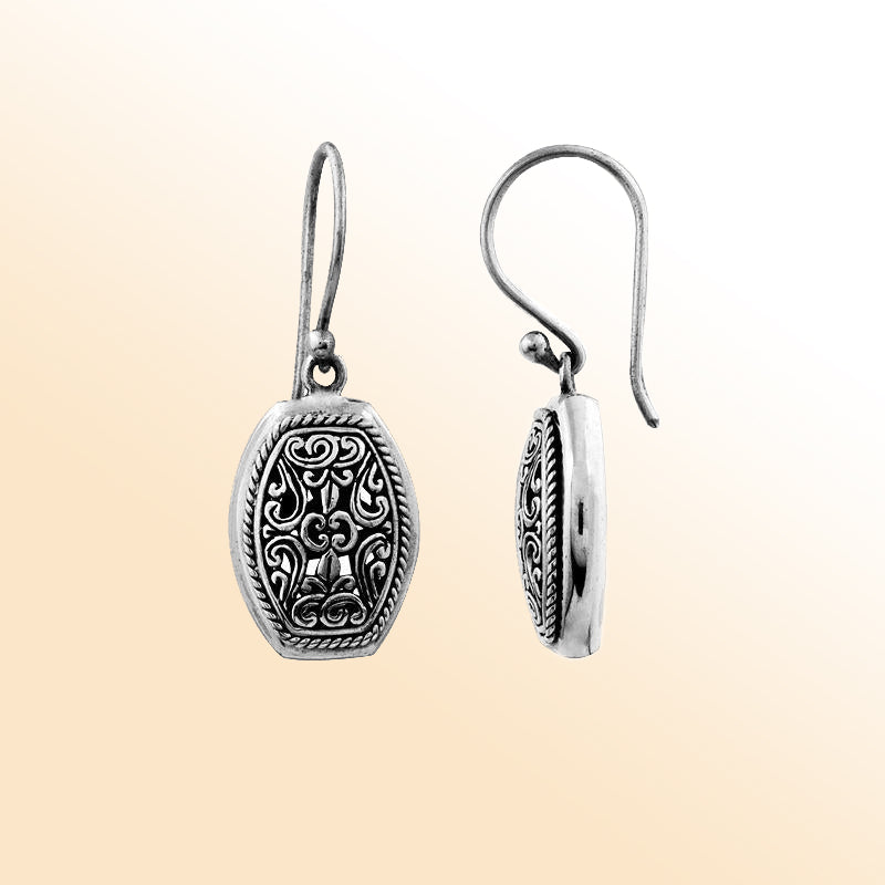 Elegant sterling silver hexagon earrings with intricate filigree scroll detailing and oxidized artisan finish.