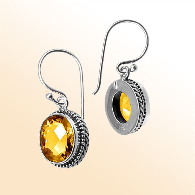 Sterling silver artisan drop earrings featuring Citrine Quartz in an ornate frame with earwire lock.