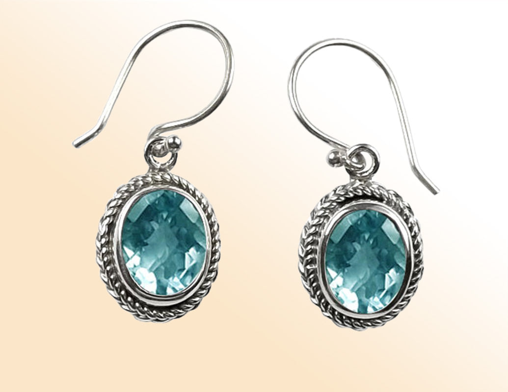 Sterling silver Blue Topaz Quartz oval rope-frame drop earrings with polished finish and earwire.