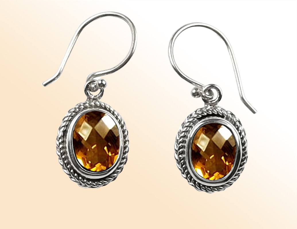 Sterling silver Citrine Quartz oval rope-frame drop earrings with polished finish and earwire.