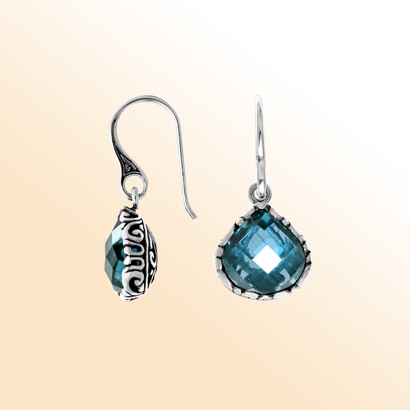 Sterling silver artisan teardrop earrings with Blue Topaz Quartz and carved detailing.
