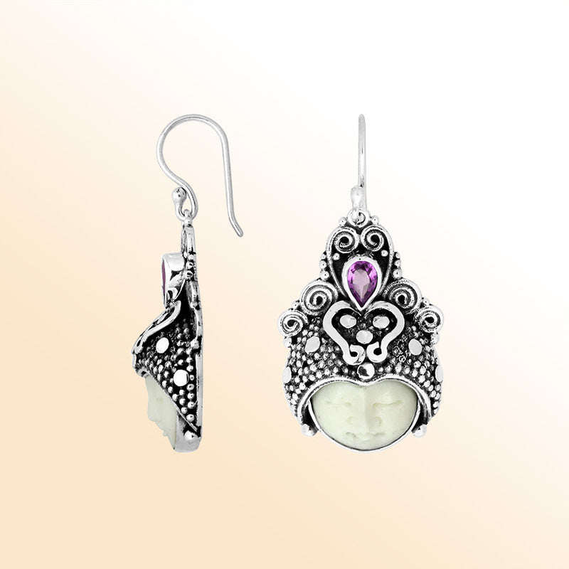 Sterling silver moon-headdress earrings featuring carved bone face and Amethyst Quartz accent.