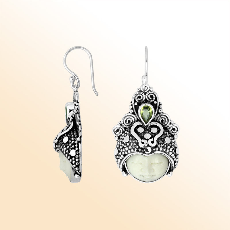 Handcrafted sterling silver earrings with Peridot Quartz and bone-carved moon face