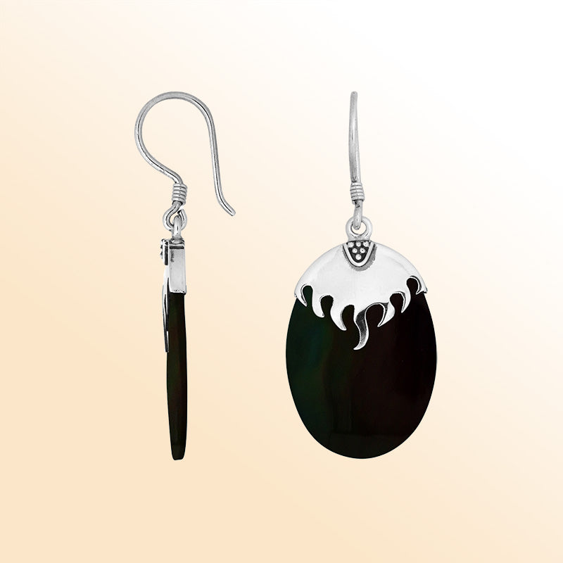 Artisan sterling silver earrings with deep Black Shell ovals beneath a flame-inspired sculpted silver cap.