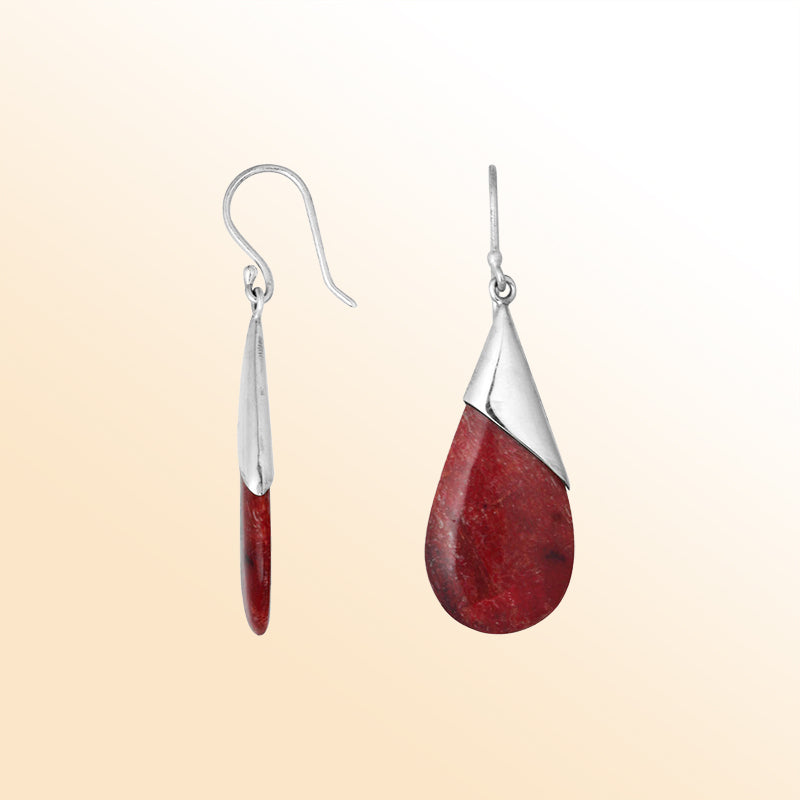 Artisan sterling silver earrings featuring warm Red Coral teardrops wrapped in a sleek tapered silver cap.