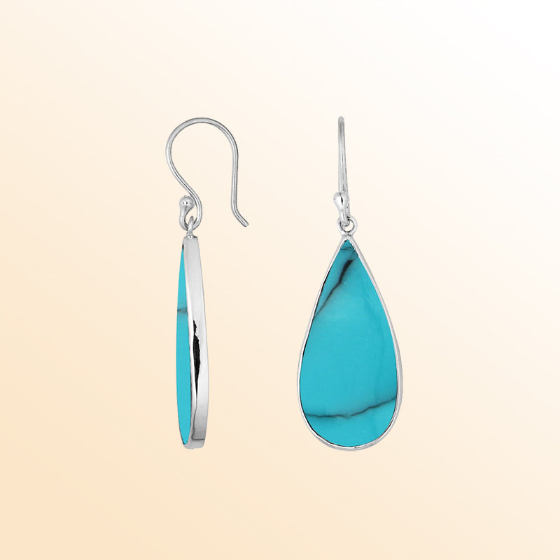 Artisan sterling silver earrings with vivid Turquoise Shell teardrops set in smooth polished bezel frames.