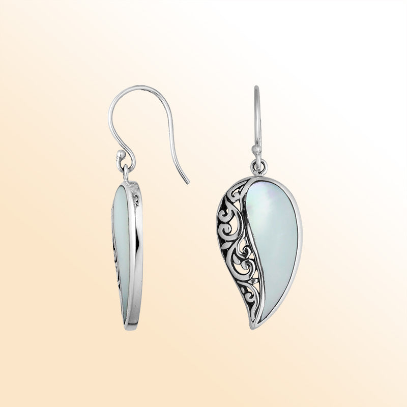 A stunning pair of 925 sterling silver earrings featuring teardrop Mother Of Pearl stones with detailed Balinese filigree design and secure earwire hooks for women.