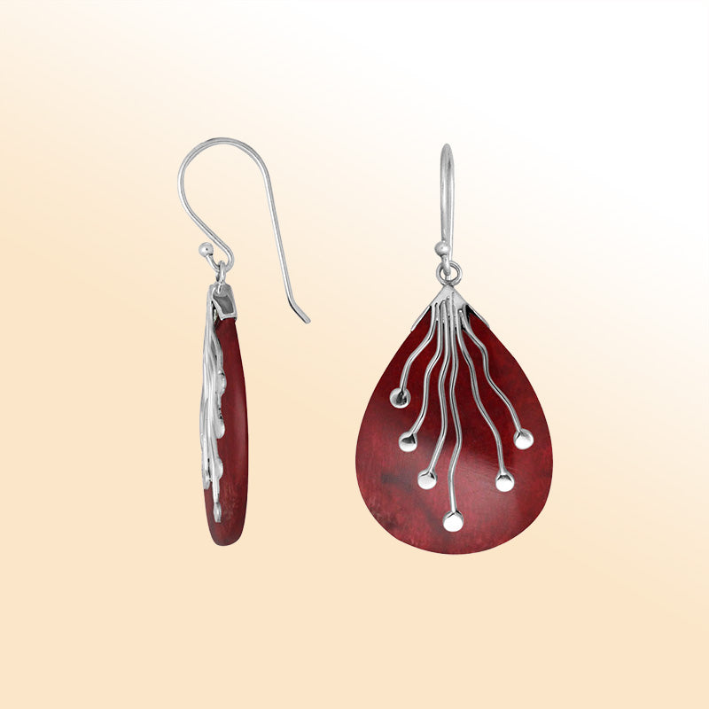 Sterling silver teardrop Red Coral earrings with artistic silver detailing handcrafted by artisans