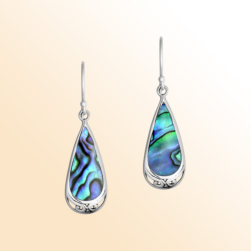 Artistic sterling silver earrings with luminous Abalone Shell teardrops and graceful silver scroll accents.