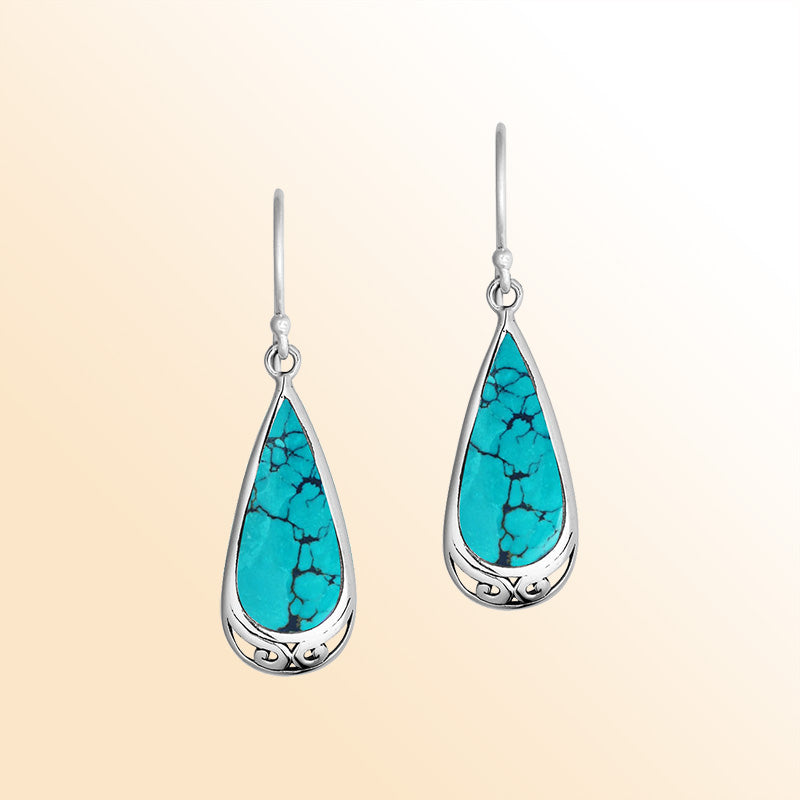 Artisan-style silver teardrop earrings showcasing vibrant Turquoise Shell with softly polished handcrafted accents.