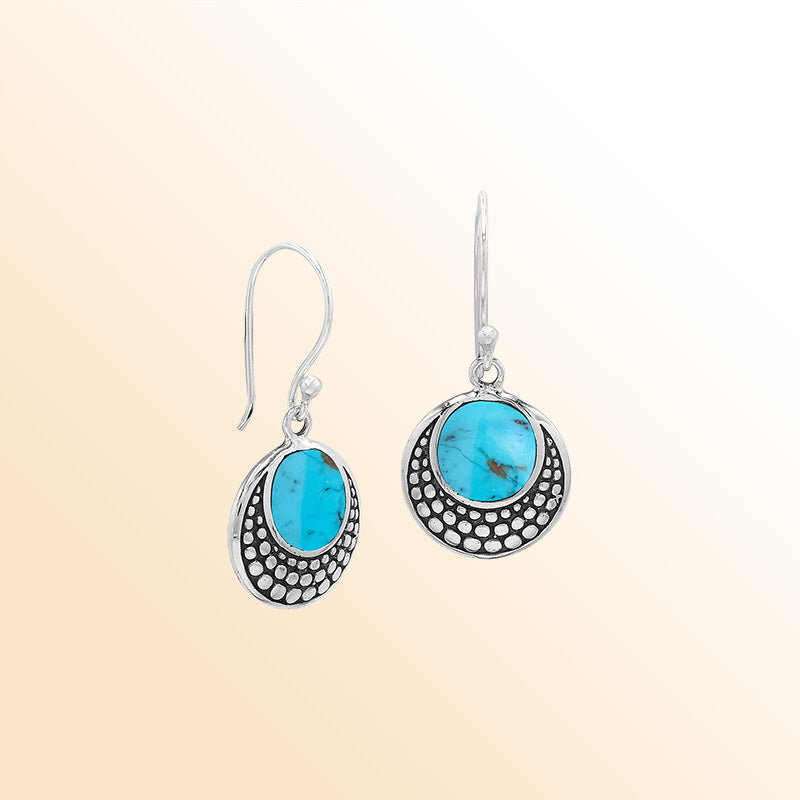 Sterling silver earrings with round Turquoise Shell inlay and dotted silver design.