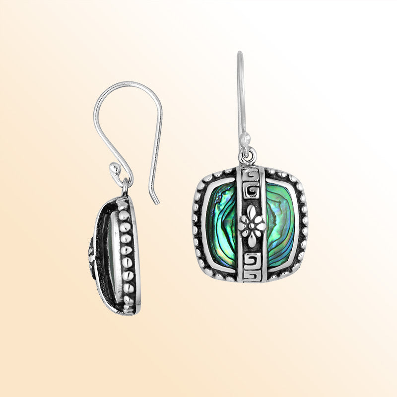 Sterling silver earrings with Abalone Shell inlay and floral geometric silver detailing.