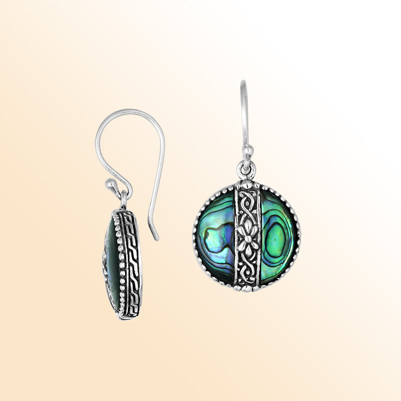 Sterling silver earrings with Abalone Shell round design and floral silver detailing.