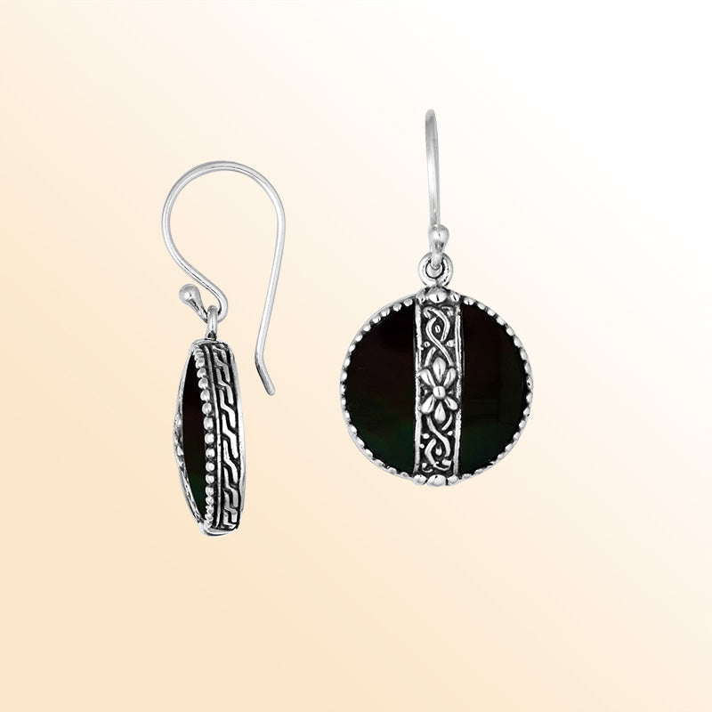 Sterling silver earrings with Black Shell round design and floral silver detailing.