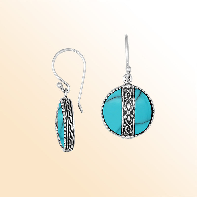 Sterling silver earrings with Turquoise Shell round design and floral silver detailing.