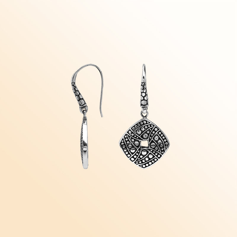 Handcrafted Balinese Sterling Silver Carved Diamond-Shaped Dangle Earrings With Dot And Swirl Pattern Detailing
