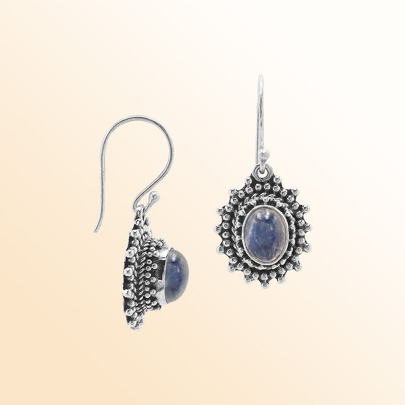 Sterling silver Bali granulated earrings featuring radiant rainbow moonstone cabochons and oxidized beadwork, created for individuals who value expressive, luminous, and artisan-crafted jewelry pieces.