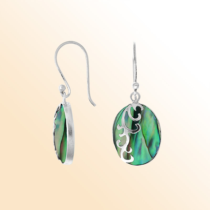 Sterling silver artisan earrings showcasing vibrant oval abalone shell with flowing wave-style overlay, crafted to create an expressive ocean-inspired look for everyday elegant styling.