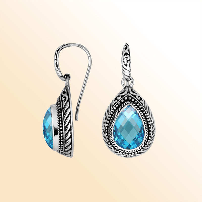 Sterling silver Blue Topaz Quartz teardrop earrings with handcrafted carved silver frame, decorative bead accents, antique-polished finish, and elegant earwire hooks designed for refined everyday and occasion wear.