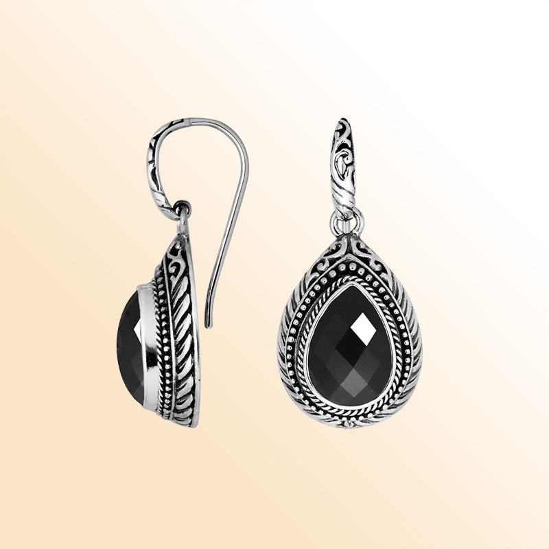 Sterling silver Black Onyx teardrop earrings with handcrafted carved silver frame, decorative bead accents, antique-polished finish, and elegant earwire hooks designed for refined everyday and special occasion wear.