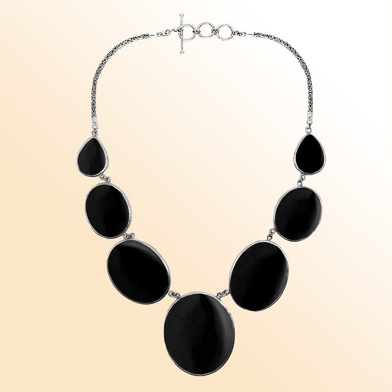 Handmade black shell and sterling silver necklace with oval and teardrop panels, elegant artisan jewelry from Bali