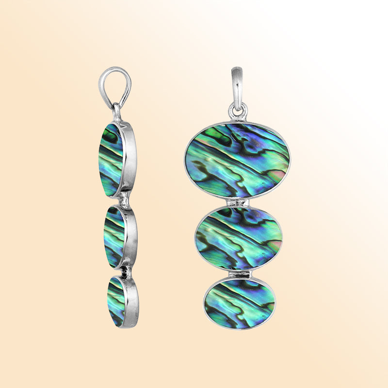 Handcrafted sterling silver pendant with three oval abalone shells, shimmering in vibrant ocean-inspired colors.