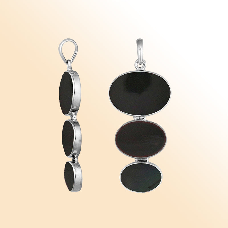 Handcrafted sterling silver pendant with three oval black shell stones, artisan Bali jewelry for bold and elegant style.