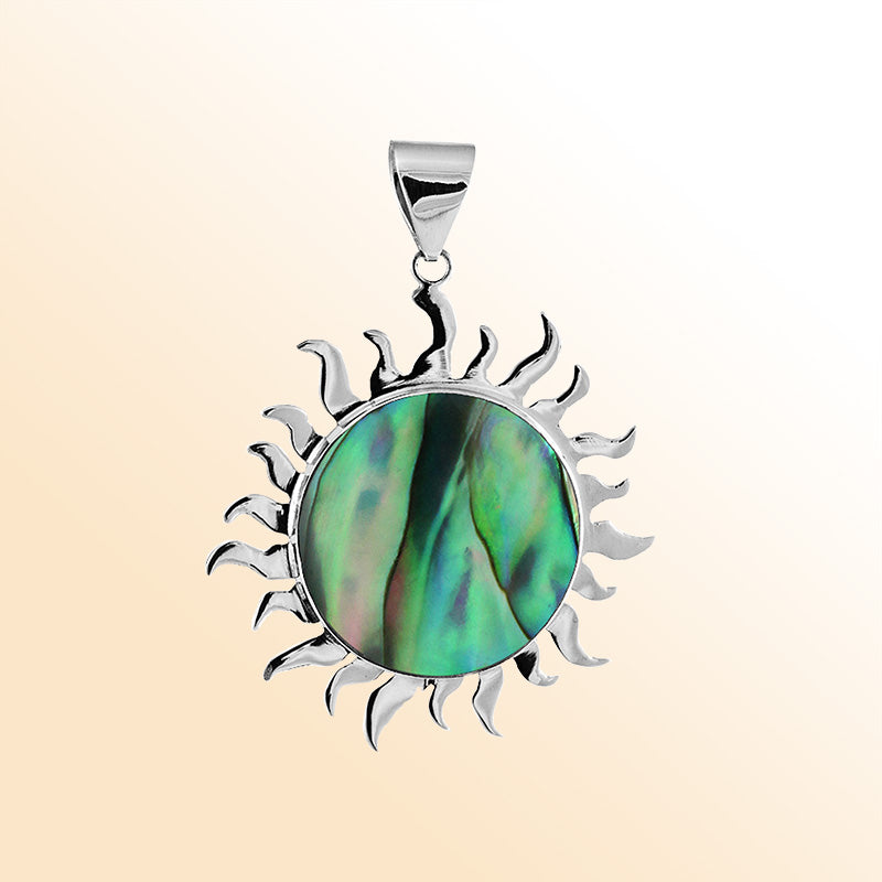 Handcrafted sterling silver sun pendant with vibrant Abalone Shell center, artisan Bali jewelry with ocean-inspired shimmer.