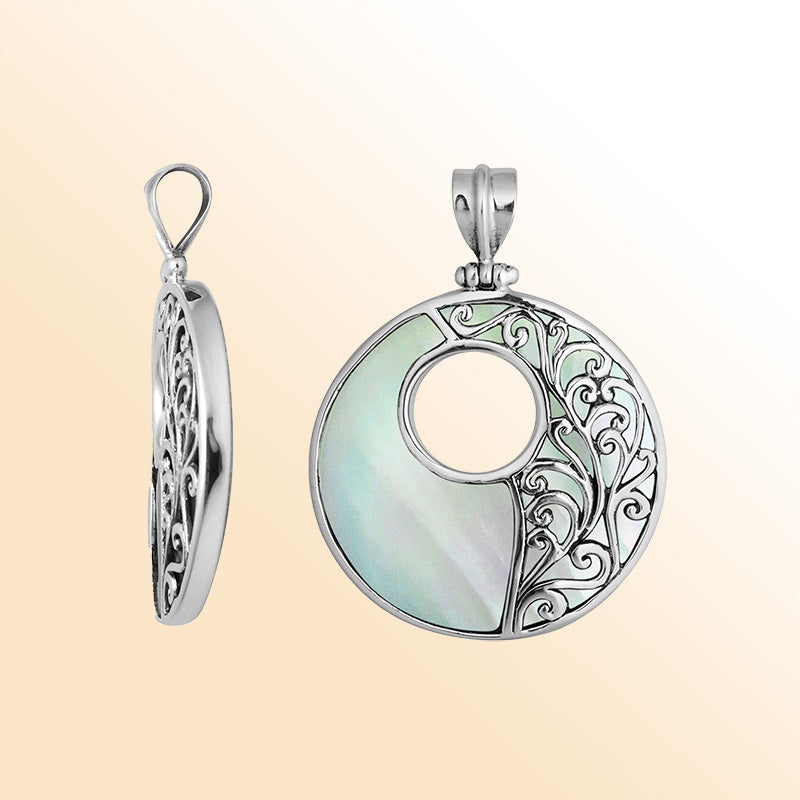 Sterling silver round Mother of Pearl pendant with luminous inlay, intricate Bali vine design, and oxidized finish, handcrafted artisan jewelry for women.