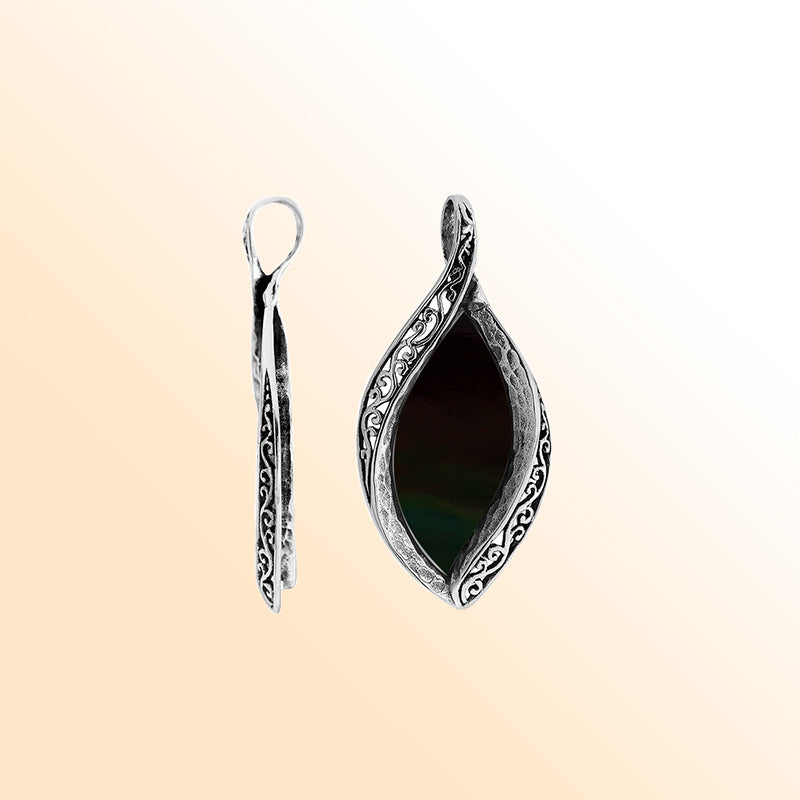 Sterling silver marquise pendant with black shell inlay and ornate Balinese carving, handcrafted in Bali.
